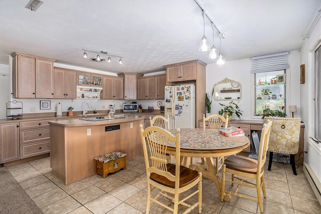 681 Gilead Shores Dr, Bronson, MI 49028 - kitchen featuring white refrigerator with ice dispenser, rail lighting, baseboard heating, a sink, and a center island