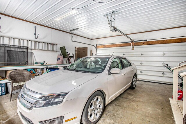 681 Gilead Shores Dr, Bronson, MI 49028 - garage featuring a garage door opener