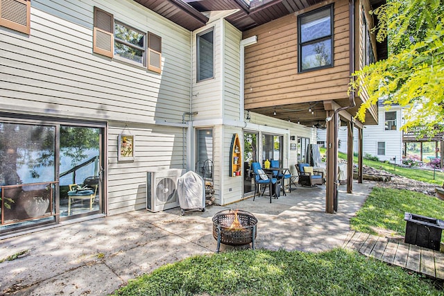 681 Gilead Shores Dr, Bronson, MI 49028 - view of patio / terrace with a fire pit and ac unit