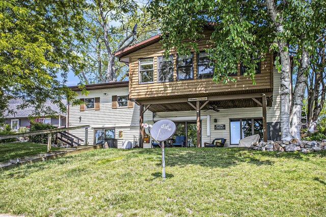 681 Gilead Shores Dr, Bronson, MI 49028 - back of house with a lawn and a ceiling fan