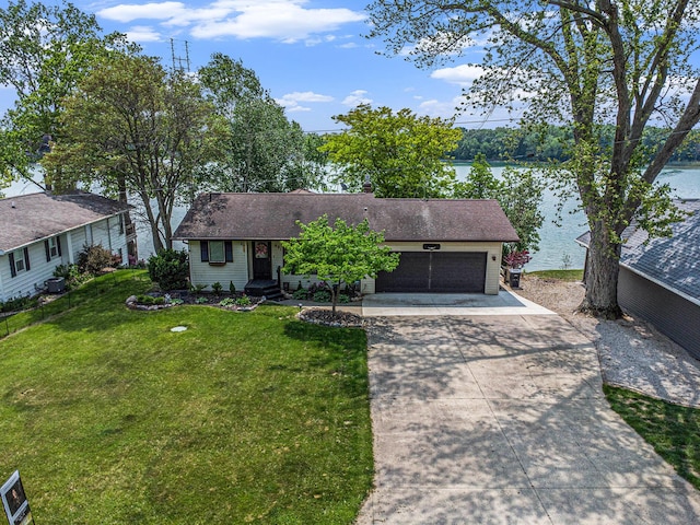 681 Gilead Shores Dr, Bronson, MI 49028 - view of front of property featuring driveway, an attached garage, a front yard, and a water view