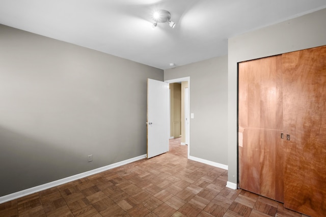 3030 Eastland Rd, Muskegon, MI 49441 - unfurnished bedroom featuring baseboards and a closet