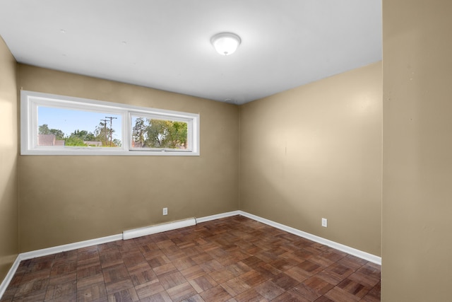 3030 Eastland Rd, Muskegon, MI 49441 - empty room featuring baseboard heating and baseboards