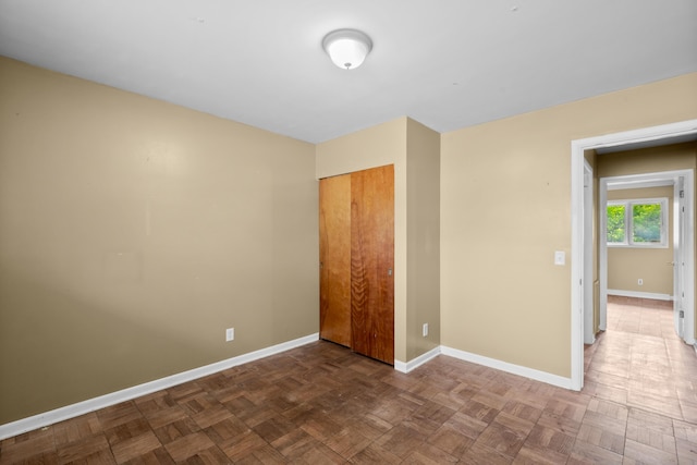 3030 Eastland Rd, Muskegon, MI 49441 - unfurnished bedroom with baseboards and a closet