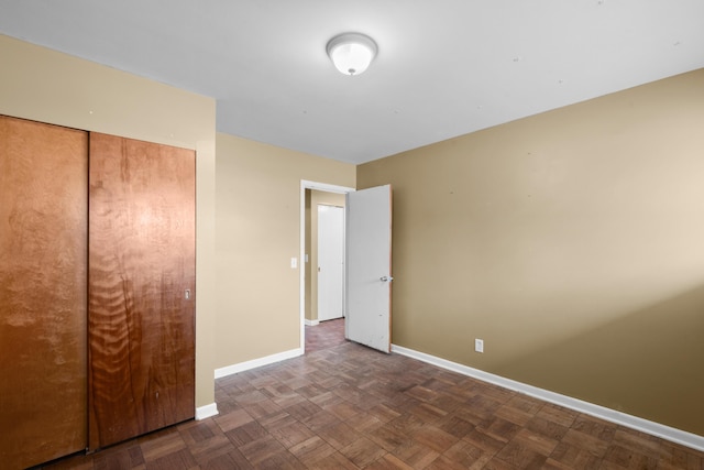 3030 Eastland Rd, Muskegon, MI 49441 - unfurnished bedroom featuring baseboards and a closet