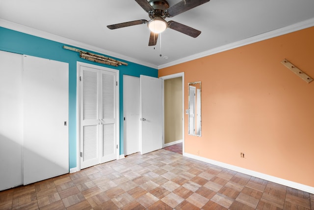 3030 Eastland Rd, Muskegon, MI 49441 - unfurnished bedroom featuring baseboards, ornamental molding, multiple closets, and ceiling fan