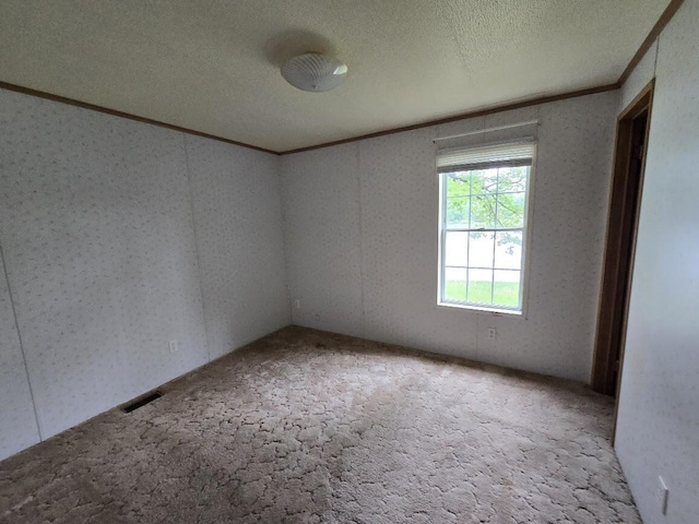 6063 Truman Rd, Barryton, MI 49305 - carpeted empty room with ornamental molding and a textured ceiling