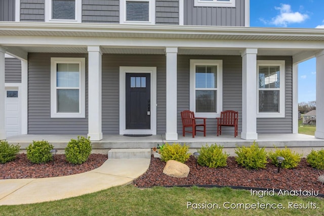 6830 Golden Vw SE, Grand Rapids, MI 49512 - doorway to property featuring covered porch and board and batten siding