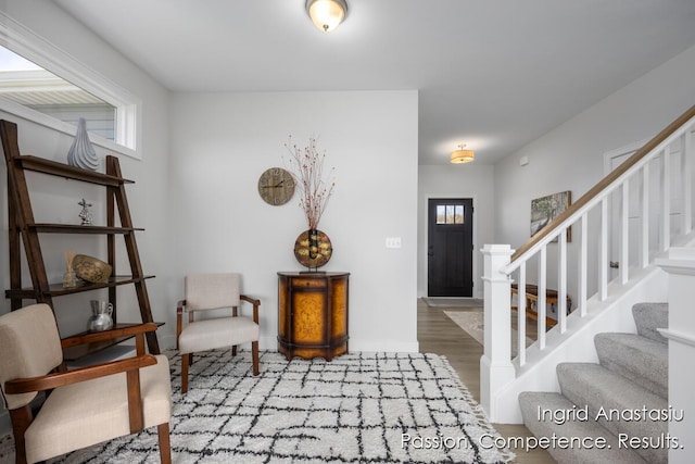 6830 Golden Vw SE, Grand Rapids, MI 49512 - foyer featuring stairway, wood finished floors, and baseboards