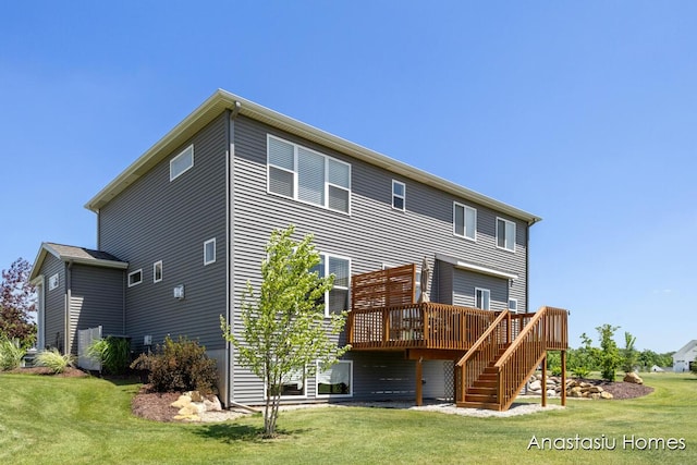 6830 Golden Vw SE, Grand Rapids, MI 49512 - back of property with a deck, a yard, and stairway