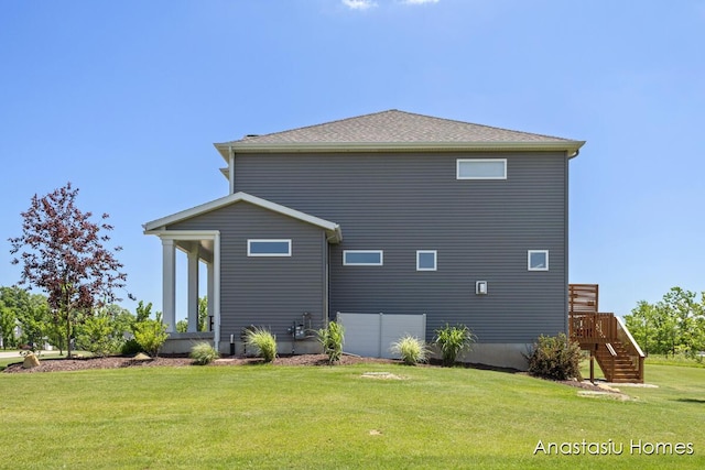 6830 Golden Vw SE, Grand Rapids, MI 49512 - back of house featuring a yard, stairway, and a wooden deck