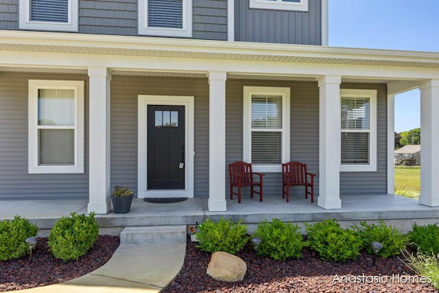 6830 Golden Vw SE, Grand Rapids, MI 49512 - view of exterior entry featuring a porch