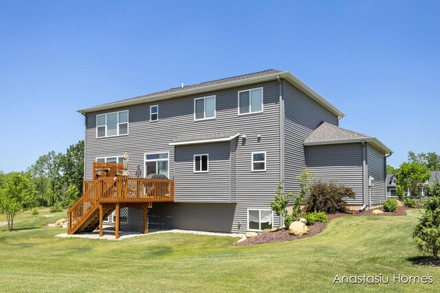6830 Golden Vw SE, Grand Rapids, MI 49512 - back of house featuring stairs, a deck, and a lawn