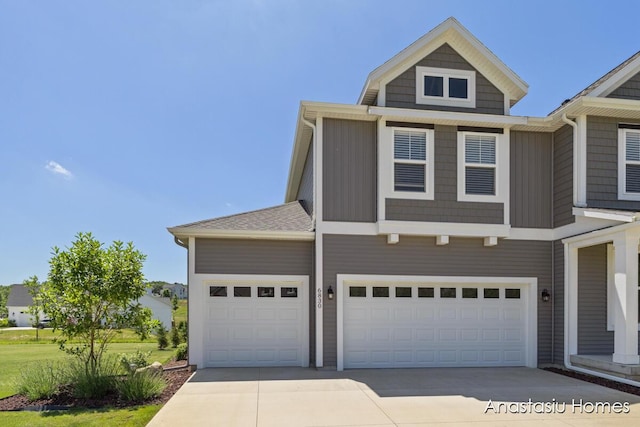 6830 Golden Vw SE, Grand Rapids, MI 49512 - view of front of house with concrete driveway and a garage