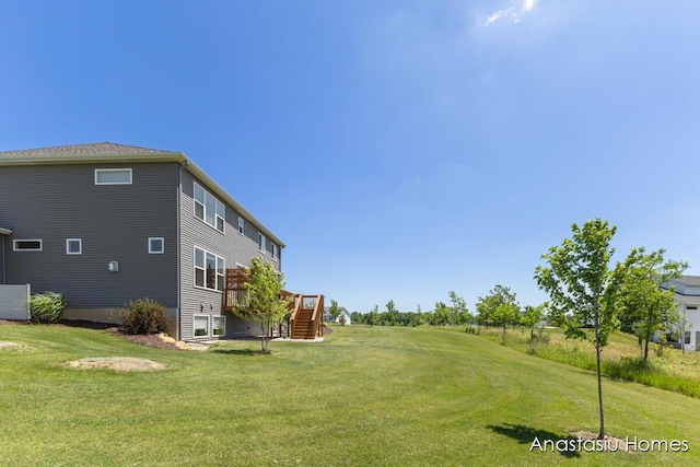 6830 Golden Vw SE, Grand Rapids, MI 49512 - view of green lawn featuring stairs and a deck