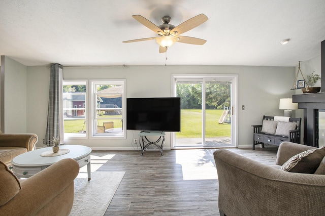 11494 18 1/2 Mile Rd, Marshall, MI 49068 - living area with baseboards, wood finished floors, and ceiling fan
