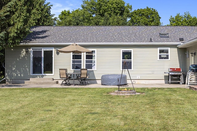 11494 18 1/2 Mile Rd, Marshall, MI 49068 - rear view of house featuring a patio area and a lawn