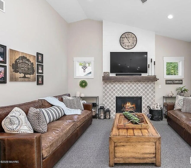 4087 Ronalds Rd, Dorr, MI 49323 - living area featuring carpet floors, a fireplace, recessed lighting, and high vaulted ceiling
