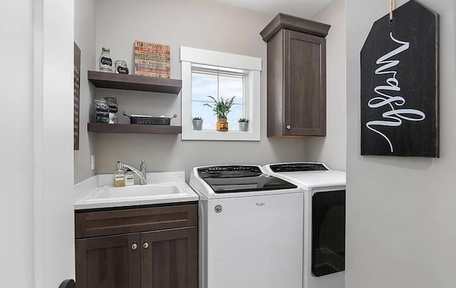 4087 Ronalds Rd, Dorr, MI 49323 - laundry area with independent washer and dryer and cabinet space