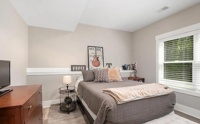 4087 Ronalds Rd, Dorr, MI 49323 - bedroom with baseboards and wood finished floors