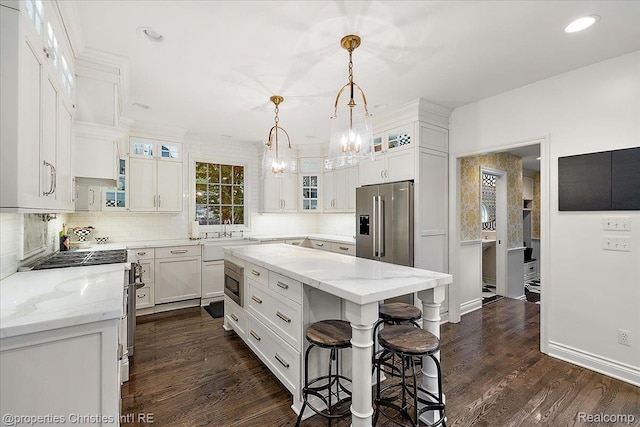 364 Chesterfield Ave, Birmingham, MI 48009 - kitchen with stainless steel appliances, decorative backsplash, a chandelier, white cabinetry, and recessed lighting