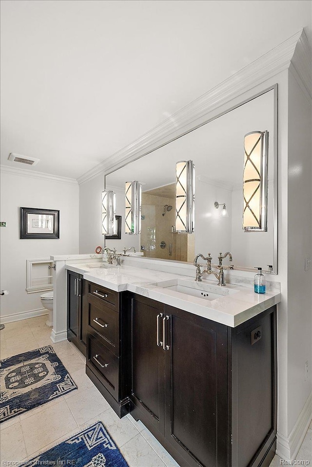 364 Chesterfield Ave, Birmingham, MI 48009 - bathroom with crown molding, double vanity, toilet, a tile shower, and baseboards