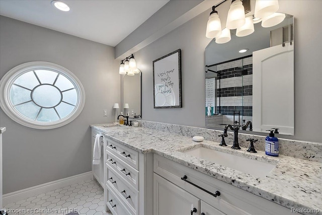 364 Chesterfield Ave, Birmingham, MI 48009 - full bath featuring double vanity, a stall shower, tile patterned flooring, baseboards, and a chandelier