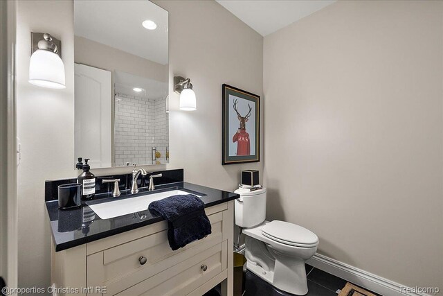 364 Chesterfield Ave, Birmingham, MI 48009 - bathroom with vanity, toilet, baseboards, tile patterned floors, and recessed lighting