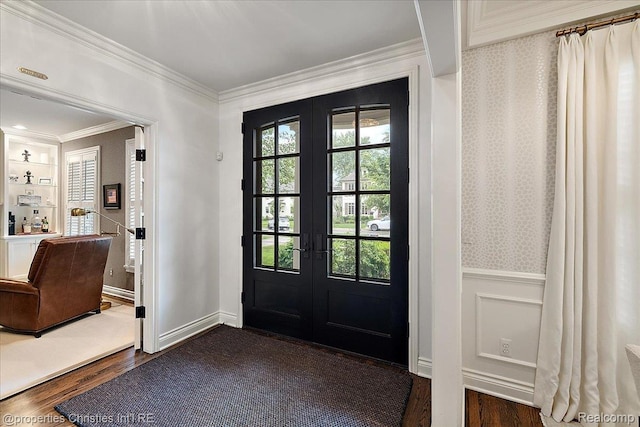 364 Chesterfield Ave, Birmingham, MI 48009 - foyer entrance featuring french doors, crown molding, dark wood-type flooring, a wainscoted wall, and a decorative wall