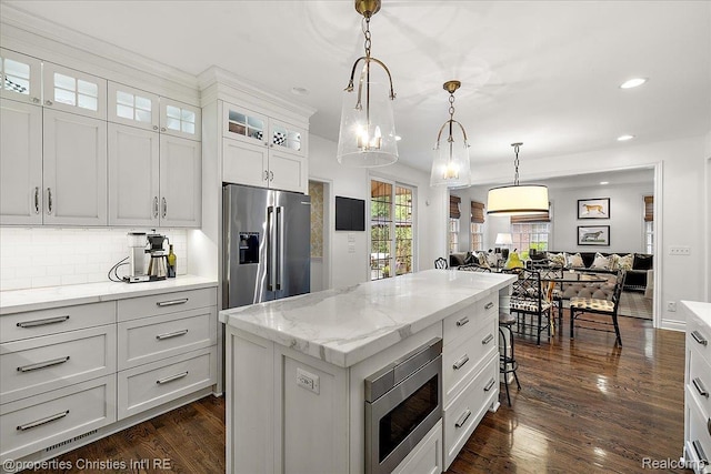 364 Chesterfield Ave, Birmingham, MI 48009 - kitchen with appliances with stainless steel finishes, backsplash, recessed lighting, dark wood-style floors, and hanging light fixtures