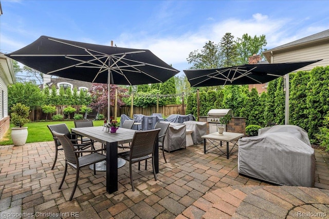 364 Chesterfield Ave, Birmingham, MI 48009 - fenced backyard with outdoor dining area and a patio