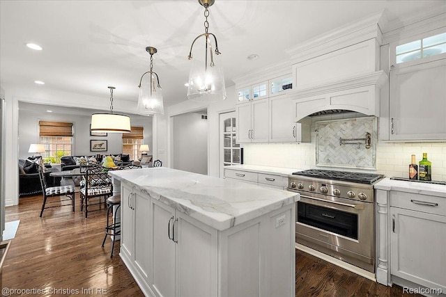 364 Chesterfield Ave, Birmingham, MI 48009 - kitchen featuring stainless steel range, a kitchen island, backsplash, white cabinetry, and glass insert cabinets