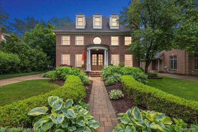 364 Chesterfield Ave, Birmingham, MI 48009 - georgian-style home with french doors, brick siding, and a front yard