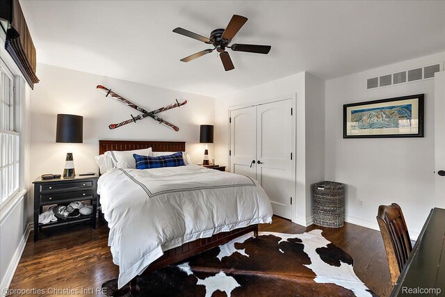 364 Chesterfield Ave, Birmingham, MI 48009 - bedroom with baseboards, a closet, dark wood-type flooring, and ceiling fan