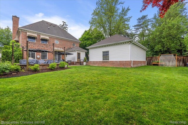 364 Chesterfield Ave, Birmingham, MI 48009 - rear view of house featuring a chimney and brick siding