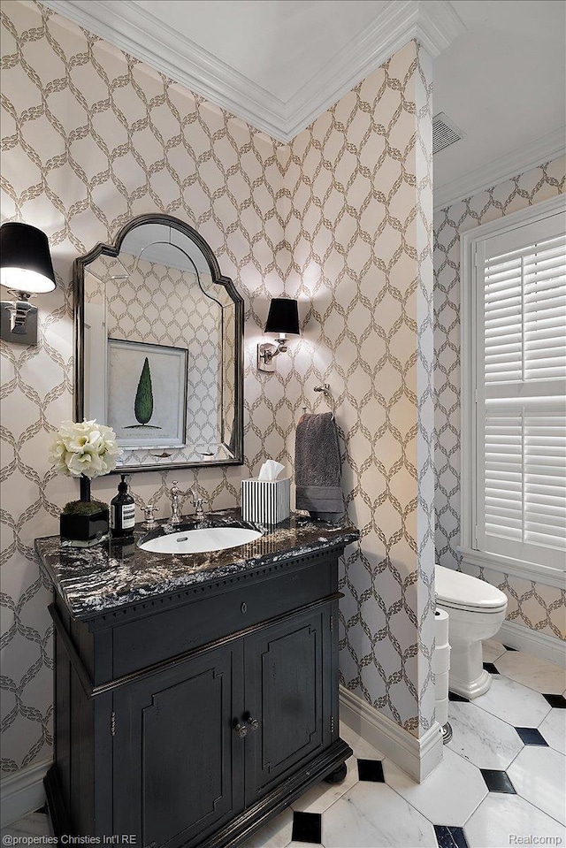 364 Chesterfield Ave, Birmingham, MI 48009 - bathroom with ornamental molding, vanity, baseboards, wallpapered walls, and toilet