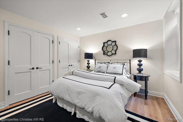 364 Chesterfield Ave, Birmingham, MI 48009 - bedroom with wood finished floors, baseboards, multiple closets, and recessed lighting
