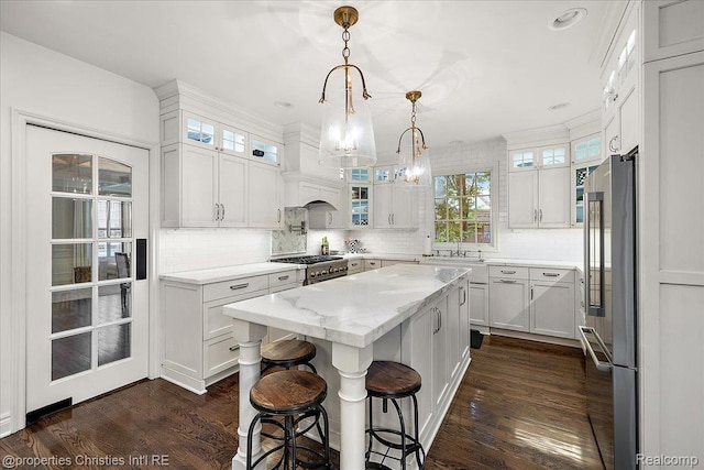 364 Chesterfield Ave, Birmingham, MI 48009 - kitchen featuring high quality appliances, a kitchen island, decorative backsplash, white cabinetry, and recessed lighting