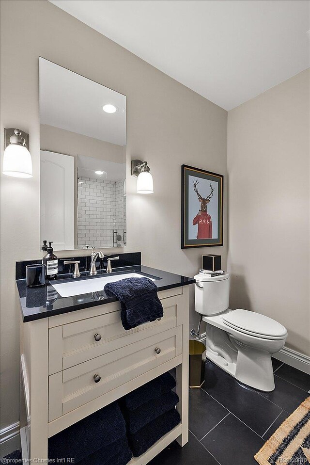 364 Chesterfield Ave, Birmingham, MI 48009 - full bath with toilet, vanity, tile patterned floors, a shower, and baseboards