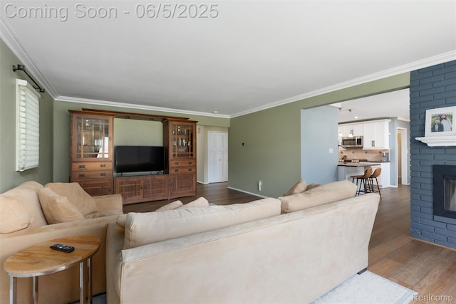 5908 Burnham Rd, Bloomfield Hills, MI 48302 - living room featuring dark wood-style flooring, ornamental molding, and a fireplace