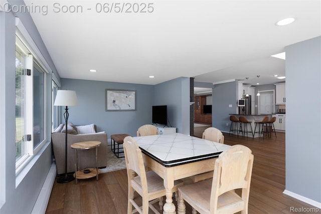 5908 Burnham Rd, Bloomfield Hills, MI 48302 - dining room with dark wood finished floors, recessed lighting, baseboards, and baseboard heating