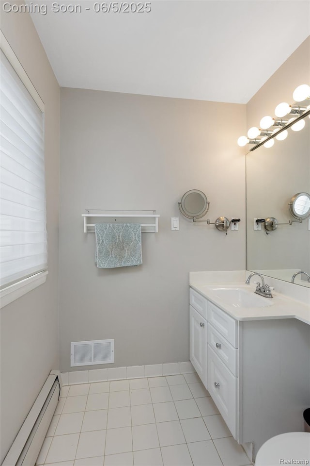 5908 Burnham Rd, Bloomfield Hills, MI 48302 - bathroom featuring a baseboard heating unit, vanity, toilet, and healthy amount of natural light