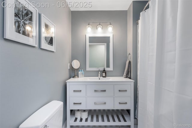 5908 Burnham Rd, Bloomfield Hills, MI 48302 - bathroom with vanity, toilet, and a shower with shower curtain