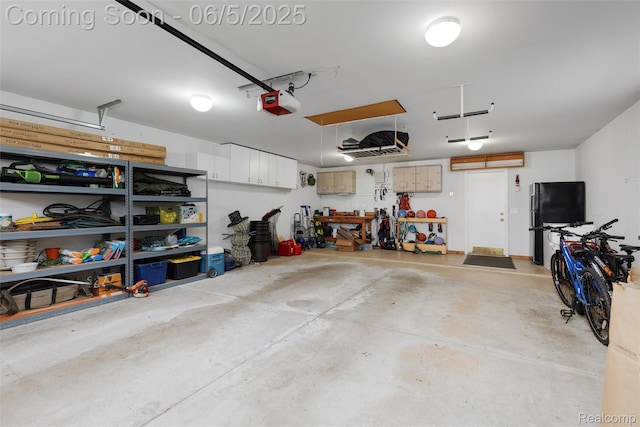 5908 Burnham Rd, Bloomfield Hills, MI 48302 - garage with freestanding refrigerator and a garage door opener
