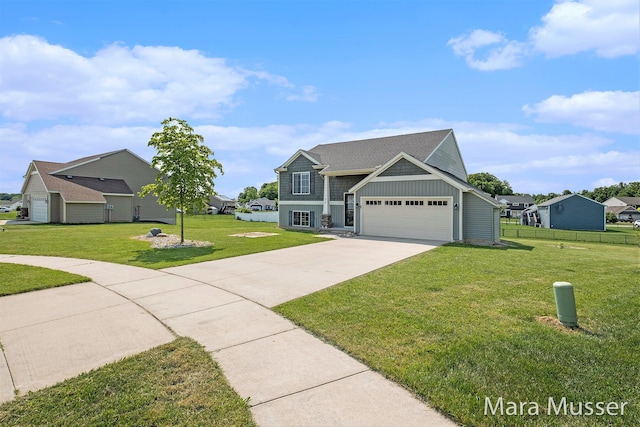 310 Robin Ct, Caledonia, MI 49316 - view of front facade featuring concrete driveway, a garage, and board and batten siding