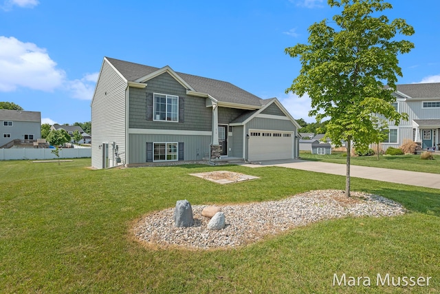 310 Robin Ct, Caledonia, MI 49316 - view of front facade with driveway and a garage
