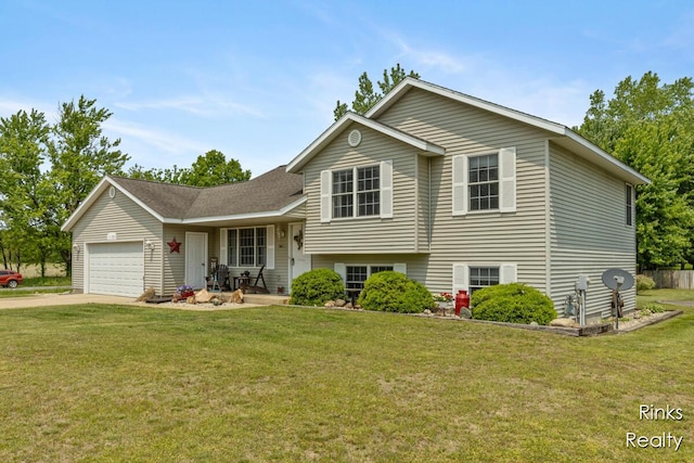 11185 Stanton St, West Olive, MI 49460 - tri-level home featuring a front lawn, a garage, and concrete driveway