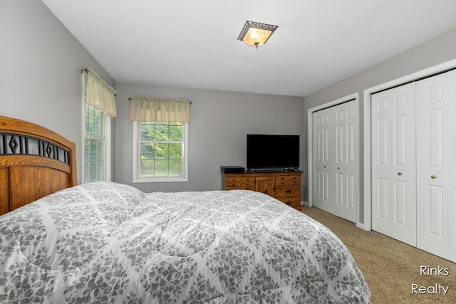 11185 Stanton St, West Olive, MI 49460 - carpeted bedroom with multiple closets