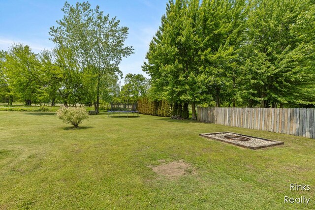 11185 Stanton St, West Olive, MI 49460 - view of yard with a trampoline