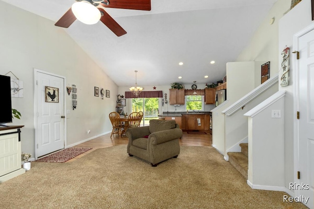 11185 Stanton St, West Olive, MI 49460 - living area with light colored carpet, a ceiling fan, a chandelier, stairs, and recessed lighting